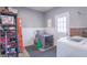 Well-organized garage featuring storage shelves, and washer in a well lit room with paneled walls at 6404 W Ray St, Indianapolis, IN 46241
