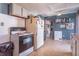 Cozy kitchen with white cabinets, appliances, and a ceiling fan for added comfort at 6404 W Ray St, Indianapolis, IN 46241
