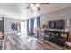 Inviting living room with new flooring, a large TV, and a bright open feel at 6404 W Ray St, Indianapolis, IN 46241