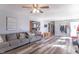 Cozy living room showcasing new floors, ample seating, and an open layout into the kitchen at 6404 W Ray St, Indianapolis, IN 46241