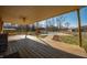 Spacious back porch with views of the fenced-in backyard, pool, and an outbuilding at 6602 S 400 W, Columbus, IN 47201