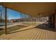 Spacious back porch with views of the fenced-in backyard, pool, and an outbuilding at 6602 S 400 W, Columbus, IN 47201