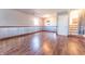 Finished basement space with wood-look flooring, wainscotting, and a light, bright, window at 6602 S 400 W, Columbus, IN 47201