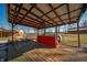 Outdoor deck with a wooden bar and overhead roof at 6602 S 400 W, Columbus, IN 47201