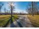 Long residential driveway leading to a two-story home at 6602 S 400 W, Columbus, IN 47201