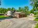 View of the home, featuring an attached two-car garage and ample parking space at 6602 S 400 W, Columbus, IN 47201