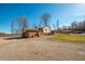 Two-story home with a charming back porch overlooking a fenced backyard with in-ground pool and outbuilding at 6602 S 400 W, Columbus, IN 47201