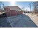 Three-car garage with a long driveway at 6602 S 400 W, Columbus, IN 47201