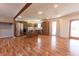 Open kitchen with stainless steel appliances, wood cabinets, island and wood floors at 6602 S 400 W, Columbus, IN 47201