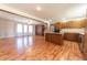 Open floor plan kitchen with stainless steel appliances and wood cabinets, flowing into living room at 6602 S 400 W, Columbus, IN 47201