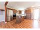 Stylish kitchen with stainless steel appliances, wood cabinets, and a central island at 6602 S 400 W, Columbus, IN 47201