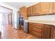 Kitchen featuring stainless steel appliances, light countertops, and wood cabinets at 6602 S 400 W, Columbus, IN 47201