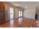 Open living room with wood floors and sliding door access to the back yard at 6602 S 400 W, Columbus, IN 47201