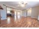 Open-concept living room with wood-look floors and a view of the kitchen at 6602 S 400 W, Columbus, IN 47201