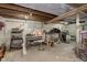 Unfinished basement space with exposed beams and concrete walls, offering potential for customization and storage at 715 S Ribble Ave, Muncie, IN 47302