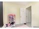 Bedroom showing a small clothes rack and door leading to closet at 715 S Ribble Ave, Muncie, IN 47302