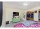 Bedroom view showcasing a full sized bed, closet, dresser, and large TV at 715 S Ribble Ave, Muncie, IN 47302