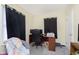 Home office bedroom space with modern desk and black-out curtains for privacy at 715 S Ribble Ave, Muncie, IN 47302