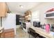 Efficient kitchen space with practical appliances and a cozy breakfast nook at 715 S Ribble Ave, Muncie, IN 47302