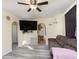 Cozy living room showcasing a ceiling fan and archway to the kitchen at 715 S Ribble Ave, Muncie, IN 47302
