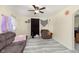 Bright living space showcasing a couch, ceiling fan, and comfortable seating at 715 S Ribble Ave, Muncie, IN 47302