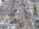 Aerial view of a wooded property outlined in red, showcasing its size and setting amongst other homes at 7971 Conarroe Rd, Indianapolis, IN 46278