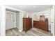 Bright bedroom features multiple windows and a calming atmosphere with neutral tones and wood laminate flooring at 7971 Conarroe Rd, Indianapolis, IN 46278