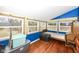 Unique bedroom with wood floors, large windows and blue walls ready for a personal touch at 7971 Conarroe Rd, Indianapolis, IN 46278