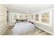 Sun-filled bedroom with many windows providing natural light and neutral decor, creating a peaceful retreat at 7971 Conarroe Rd, Indianapolis, IN 46278