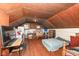 Attic bedroom with a bed and furnishings, showcasing its layout and potential at 7971 Conarroe Rd, Indianapolis, IN 46278