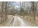 Gravel driveway winding through trees leading to the house at 7971 Conarroe Rd, Indianapolis, IN 46278