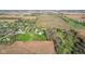 Expansive aerial view of a property featuring a blend of farmland, residential areas, and mature trees at 800 N 400 W, Bargersville, IN 46106