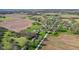 Aerial view showcasing a residential area surrounded by farmland and green spaces at 800 N 400 W, Bargersville, IN 46106