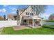 Charming backyard view of a two-story home with a covered porch and swing at 800 N 400 W, Bargersville, IN 46106