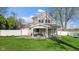 Charming backyard view of a two-story home with a covered porch and swing at 800 N 400 W, Bargersville, IN 46106
