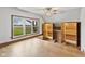 Spacious bonus room with built-in cabinets and shelving, as well as a large picture window at 800 N 400 W, Bargersville, IN 46106