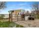Chicken coop exterior featuring a fenced enclosure and adjacent storage shed at 800 N 400 W, Bargersville, IN 46106
