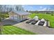 Aerial view of a tan garage with green house attached, and garden boxes at 800 N 400 W, Bargersville, IN 46106