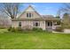 Charming home with a front porch swing, mature trees, and a well-manicured lawn at 800 N 400 W, Bargersville, IN 46106