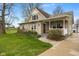Charming home with a front porch swing, walkway, and a well-manicured lawn at 800 N 400 W, Bargersville, IN 46106