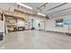 Spacious garage with shelving, workspace, and a wood-burning stove at 800 N 400 W, Bargersville, IN 46106