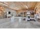 Spacious garage with ceiling fans, concrete floors, and wood paneled walls at 800 N 400 W, Bargersville, IN 46106