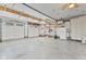 Spacious garage with white doors, a refrigerator, and plenty of storage space at 800 N 400 W, Bargersville, IN 46106