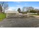 Outdoor garden area featuring raised garden beds, a greenhouse, and landscaping at 800 N 400 W, Bargersville, IN 46106