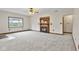 Spacious living room with a fireplace, plush carpet, and natural light from the windows at 800 N 400 W, Bargersville, IN 46106
