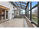 Bright sunroom with a glass roof, sliding door access, and concrete floors at 800 N 400 W, Bargersville, IN 46106