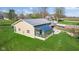 Aerial view of a bright sunroom featuring a metal roof and lush greenery at 800 N 400 W, Bargersville, IN 46106