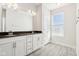 Bathroom with double sink vanity and white cabinets at 848 Kinzer Ave, Carmel, IN 46032