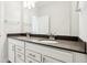 Bathroom with a double sink vanity and dark countertop at 848 Kinzer Ave, Carmel, IN 46032