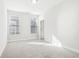 Bright bedroom with neutral walls, carpet, and natural light from two windows at 848 Kinzer Ave, Carmel, IN 46032